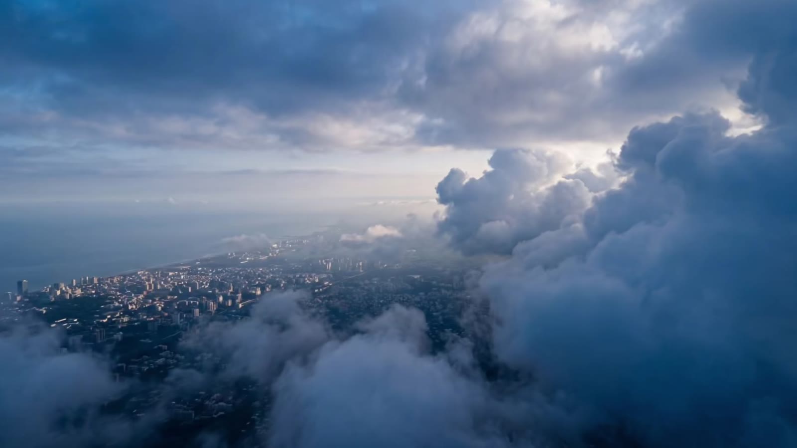 One continuous camera movement from a city to a single detail.